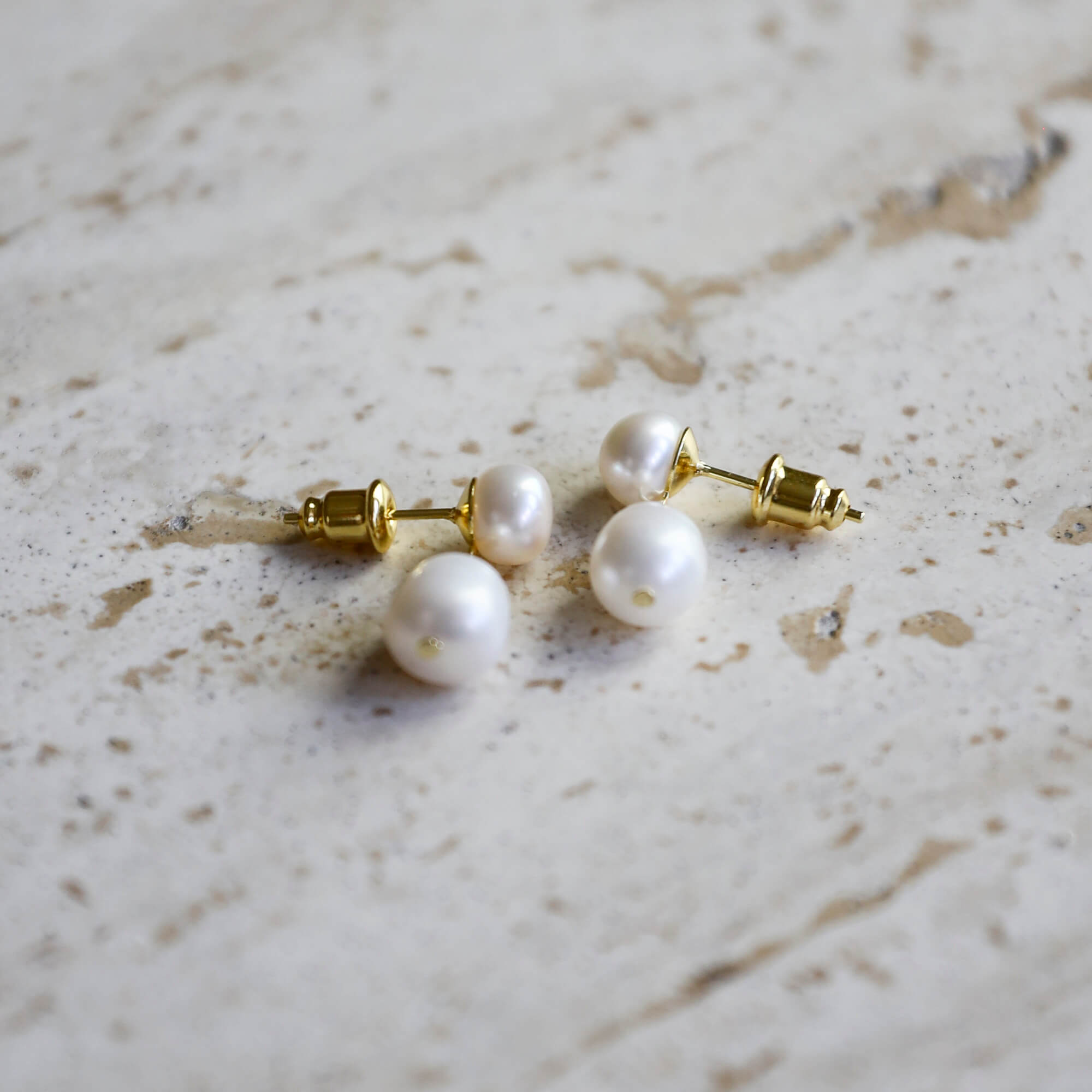 Gold-plated on sterling silver drop earrings featuring double freshwater pearls, elegant classic occasion style. - Solinu Jewellery 