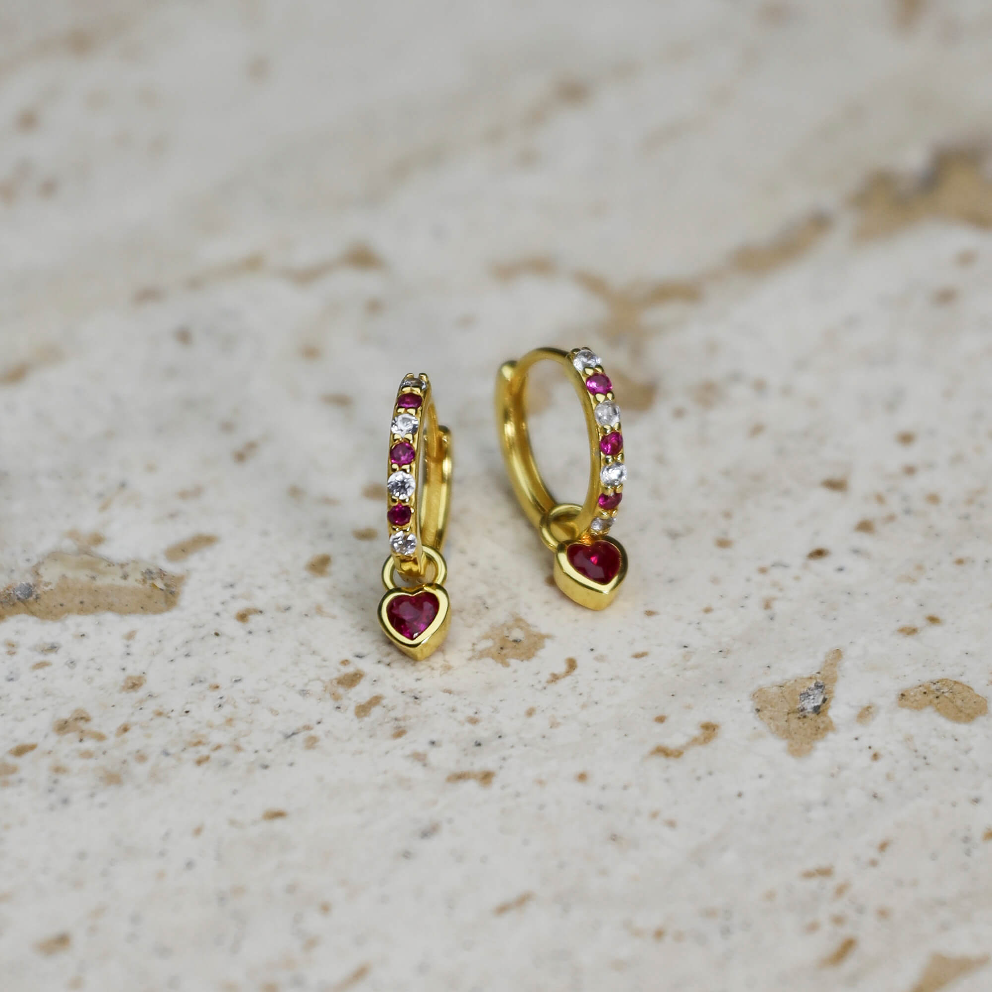 Gold-plated on sterling silver huggies with bright pink heart drop charm, cute modern everyday style. - Solinu Jewellery