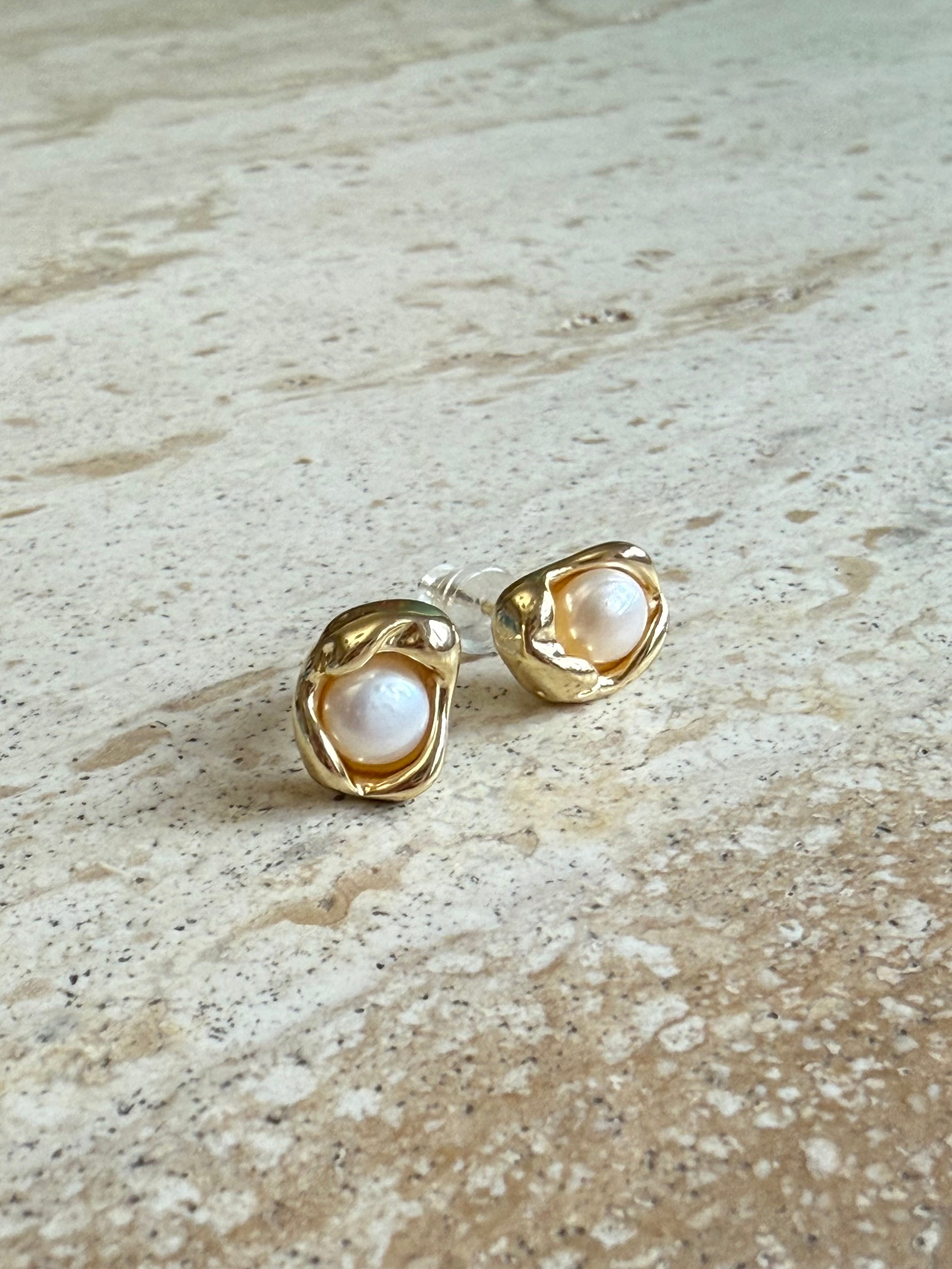 Gold earrings with pearl centers modern bridal look