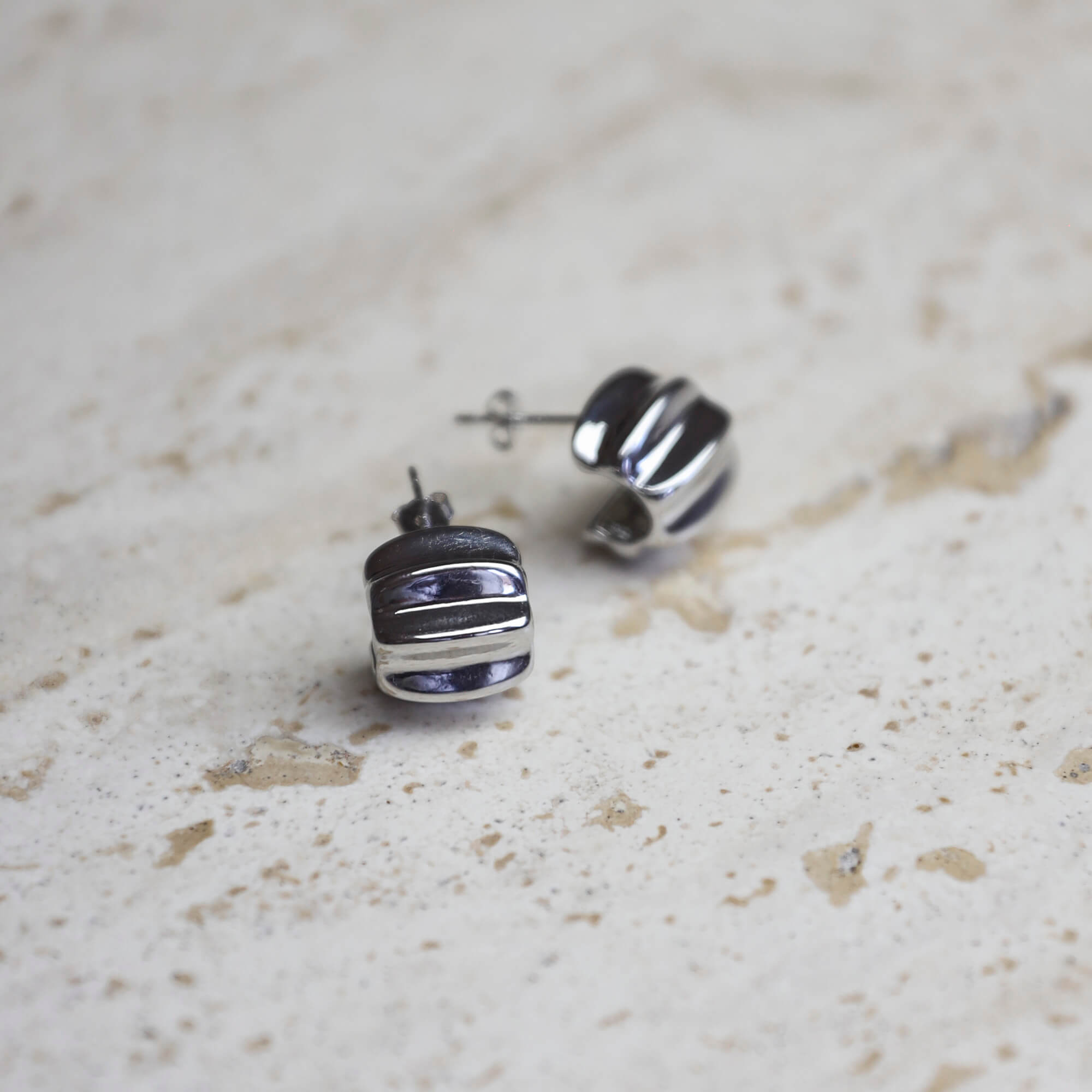 Sterling silver statement huggie earrings with bold sculptural design, modern elevated style. - Solinu Jewellery